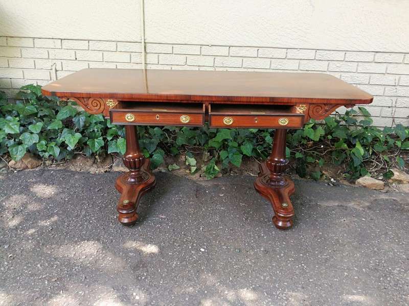 A Regency Rosewood Sofa Table With Brass Castors