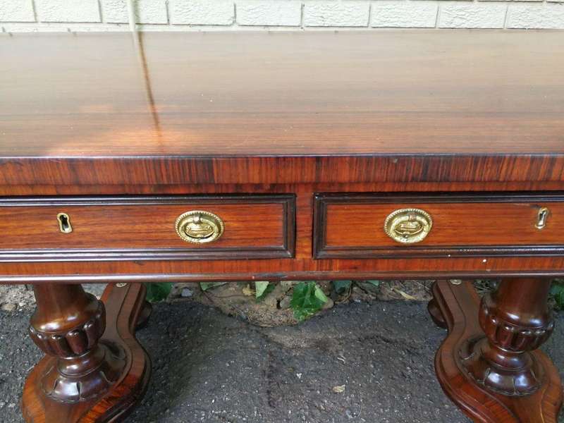 A Regency Rosewood Sofa Table With Brass Castors