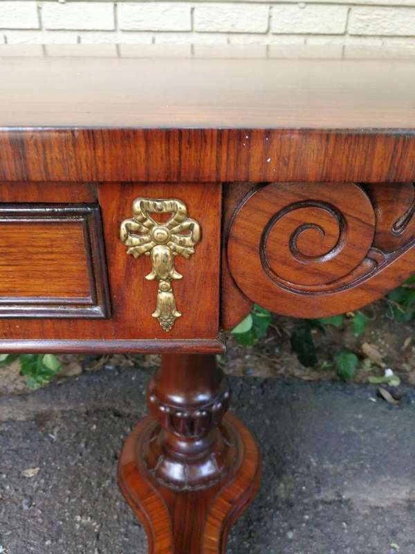 A Regency Rosewood Sofa Table With Brass Castors