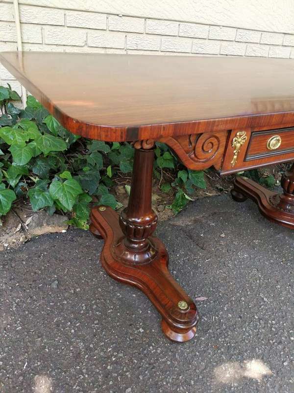 A Regency Rosewood Sofa Table With Brass Castors