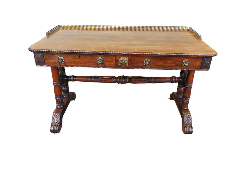 A William IV Rosewood Library Table With Brass Gallery On Brass Castors