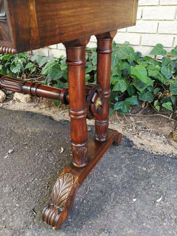 A William IV Rosewood Library Table With Brass Gallery On Brass Castors