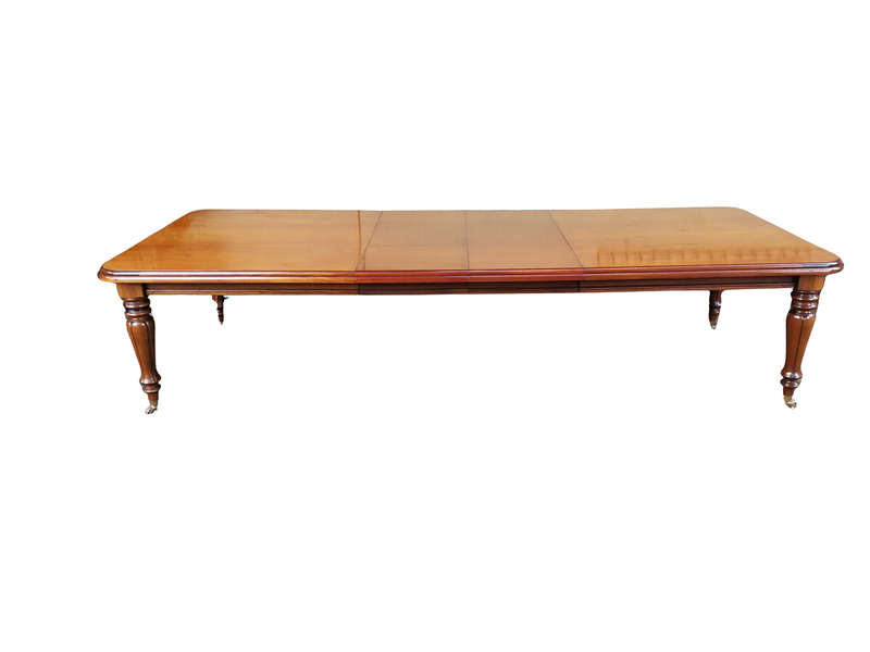 A Victorian Style Extending Dining Table With Brass Cup Castors and Two Leaves (10 to 12 Seater)