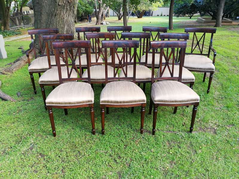 A Set Of Twelve George III Style Mahogany Dining Chairs Comprising Of Ten Chairs And Two Carvers