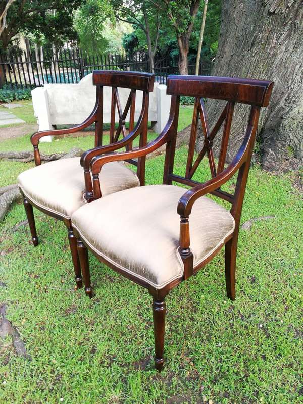 A Set Of Twelve George III Style Mahogany Dining Chairs Comprising Of Ten Chairs And Two Carvers