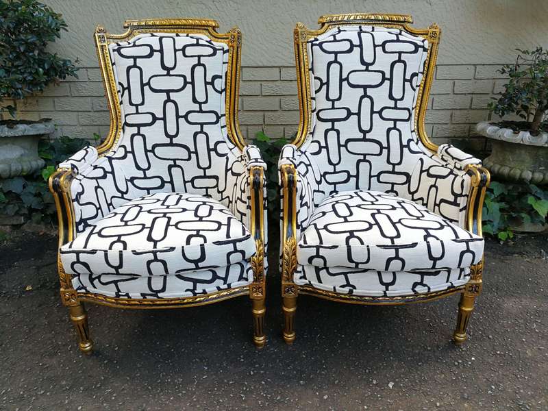 A Pair of Late 19th Century French Bergere Chairs Hand Gilded with Gold Leaf and Upholstered in i...