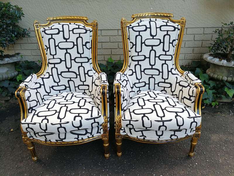 A Pair of Late 19th Century French Bergere Chairs Hand Gilded with Gold Leaf and Upholstered in i...
