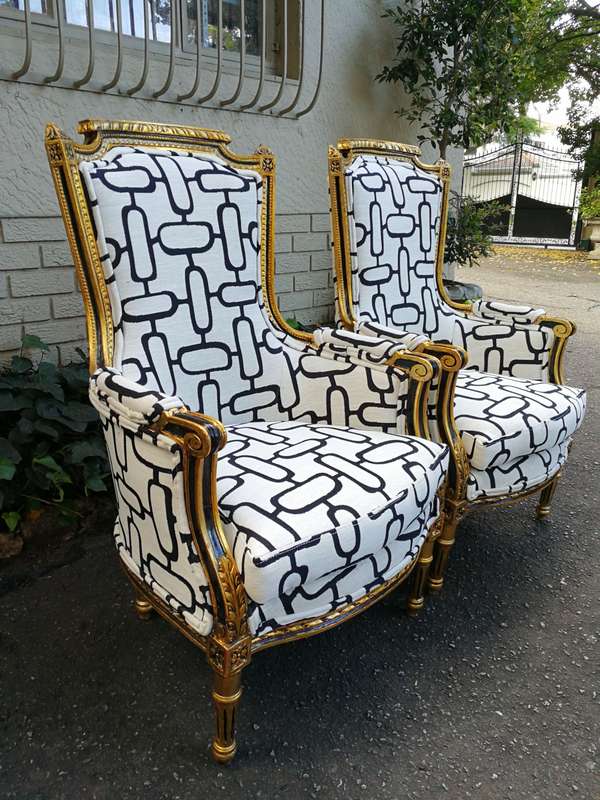 A Pair of Late 19th Century French Bergere Chairs Hand Gilded with Gold Leaf and Upholstered in i...