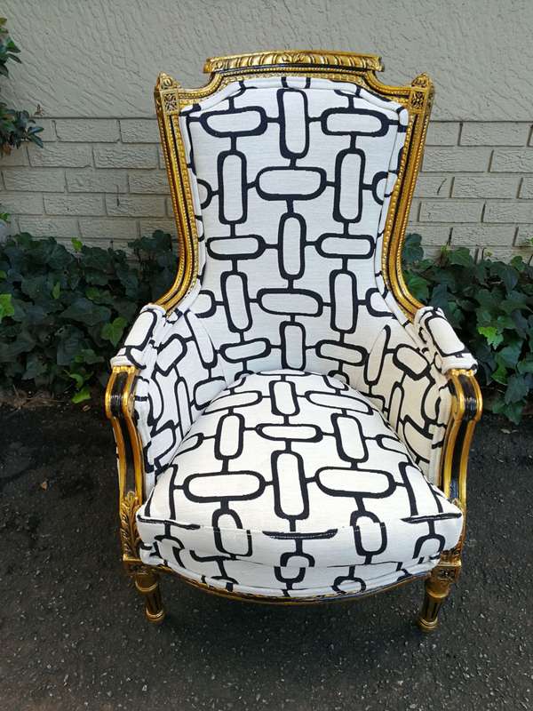 A Pair of Late 19th Century French Bergere Chairs Hand Gilded with Gold Leaf and Upholstered in i...