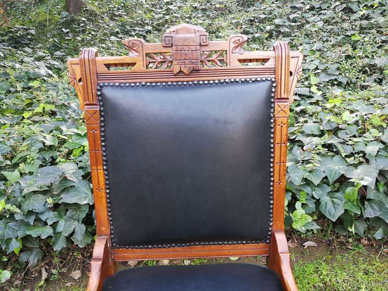 A Late 19th Century Pair of Victorian Carved Walnut Chairs Upholstered in Leather on Casters
