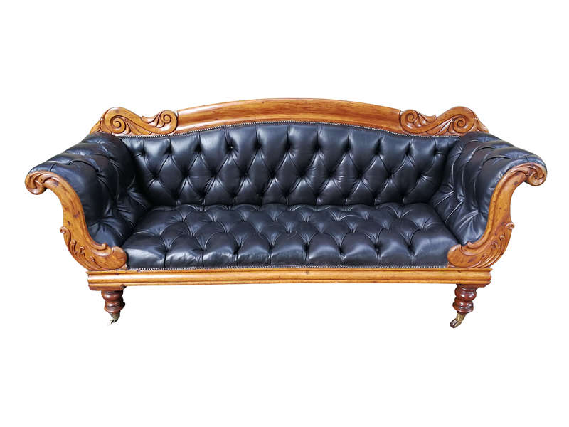 Victorian Mahogany Settee Upholstered In Deep-Buttoned Leather. Original Porcelain Casters