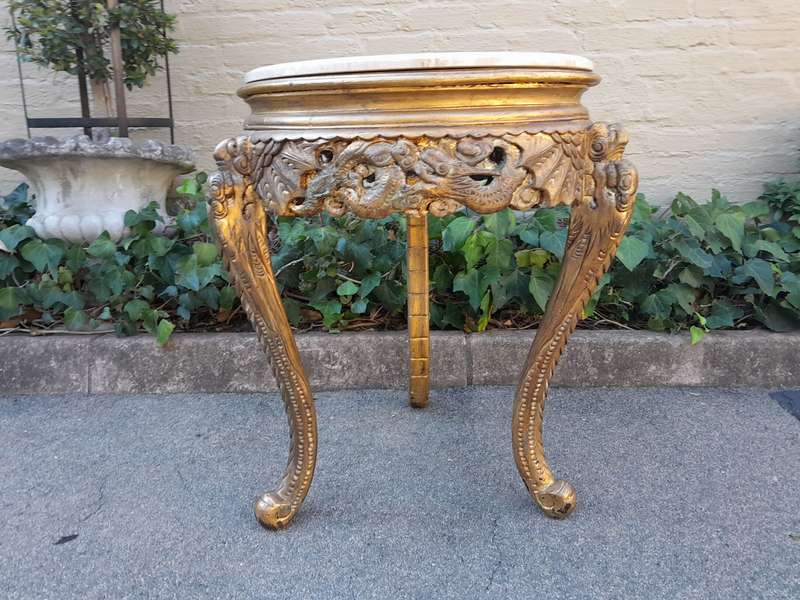 An Early 20th Century Carved and hand-gilded with gold leaf table with Marble Top