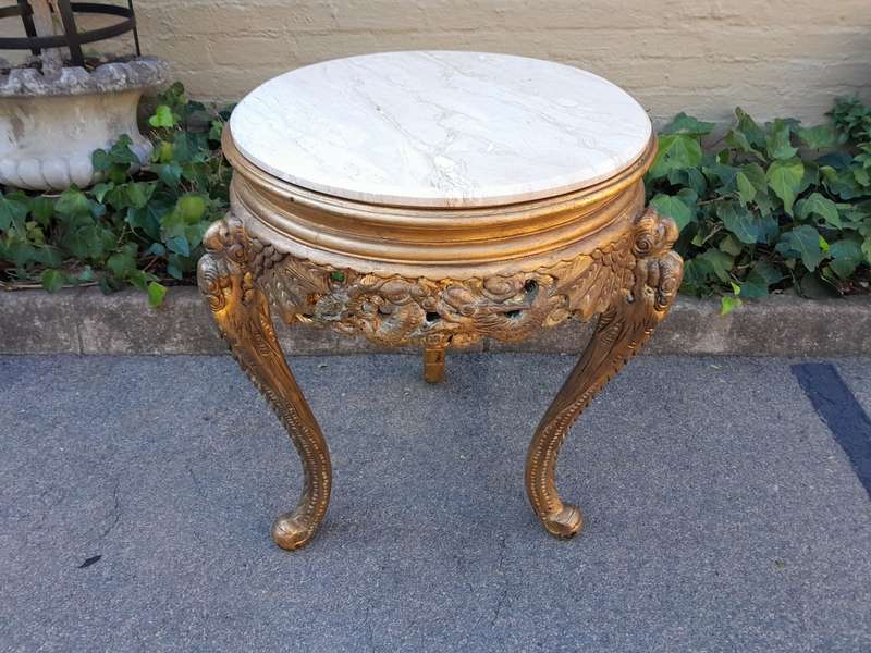 An Early 20th Century Carved and hand-gilded with gold leaf table with Marble Top