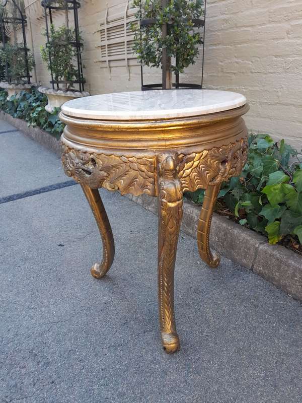 An Early 20th Century Carved and hand-gilded with gold leaf table with Marble Top