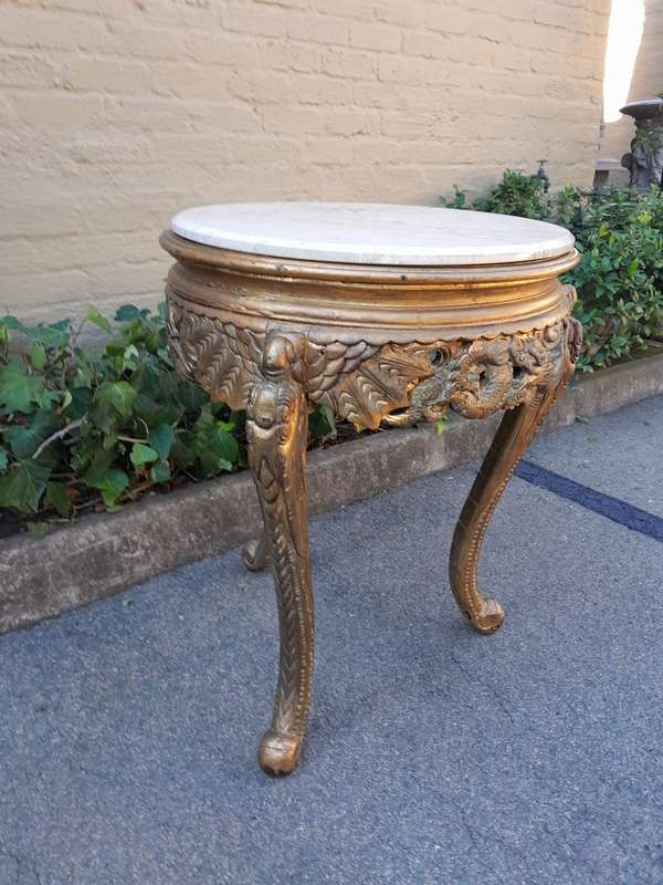 An Early 20th Century Carved and hand-gilded with gold leaf table with Marble Top