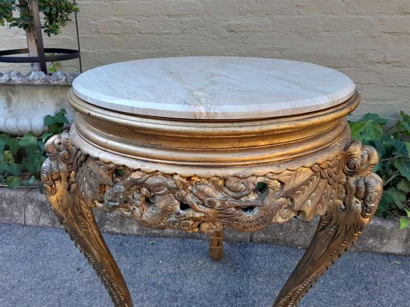 An Early 20th Century Carved and hand-gilded with gold leaf table with Marble Top