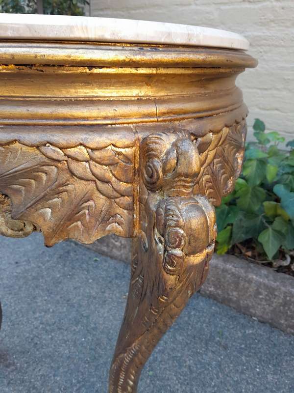 An Early 20th Century Carved and hand-gilded with gold leaf table with Marble Top