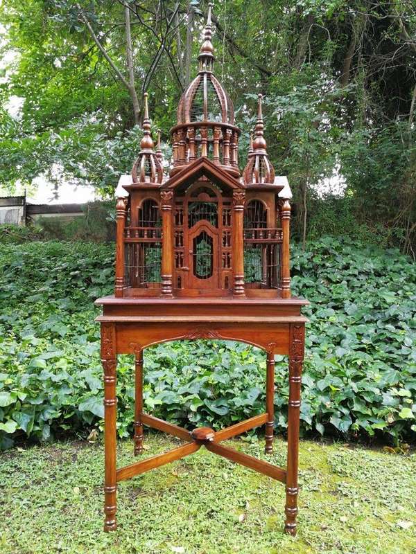 A 20th Century French Carved Mahogany and Walnut Victorian Cathedral Style Birdcage on Stand