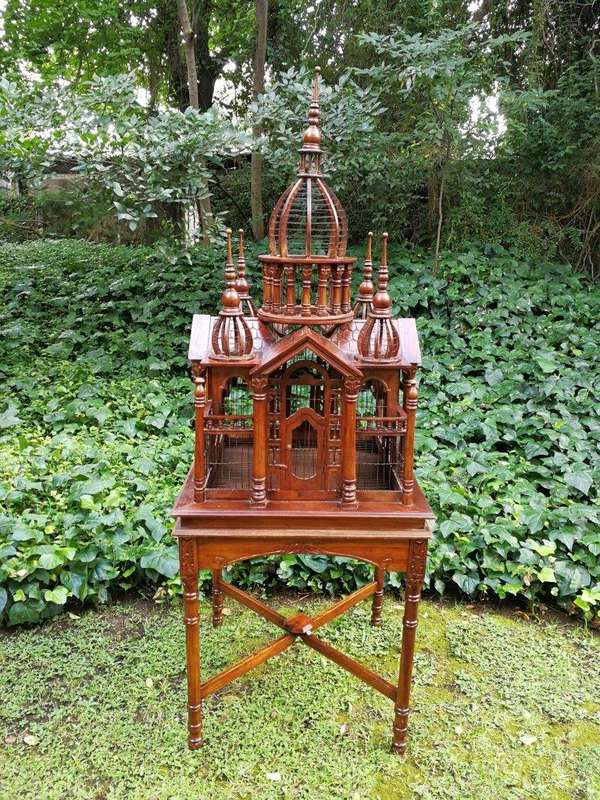A 20th Century French Carved Mahogany and Walnut Victorian Cathedral Style Birdcage on Stand
