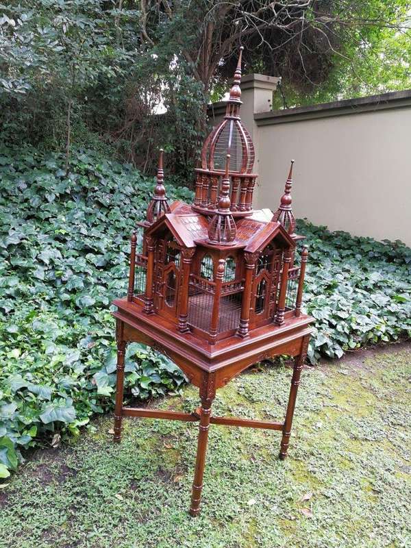A 20th Century French Carved Mahogany and Walnut Victorian Cathedral Style Birdcage on Stand