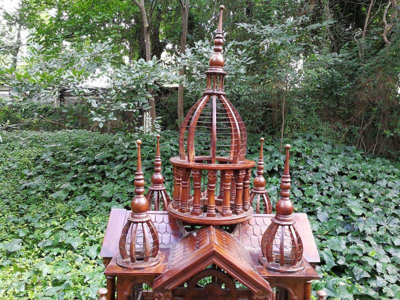 A 20th Century French Carved Mahogany and Walnut Victorian Cathedral Style Birdcage on Stand