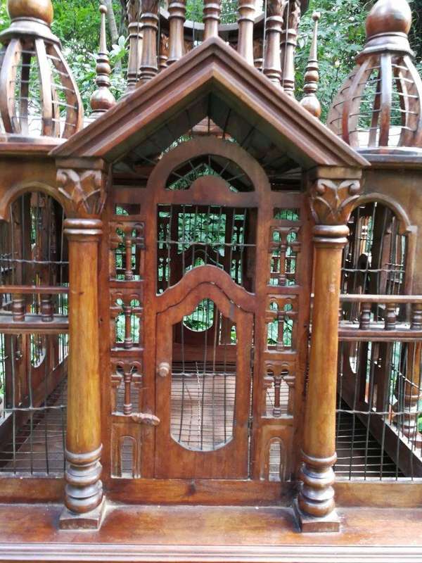 A 20th Century French Carved Mahogany and Walnut Victorian Cathedral Style Birdcage on Stand