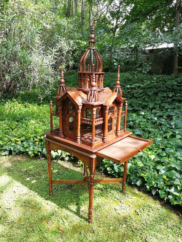 A 20th Century French Carved Mahogany and Walnut Victorian Cathedral Style Birdcage on Stand
