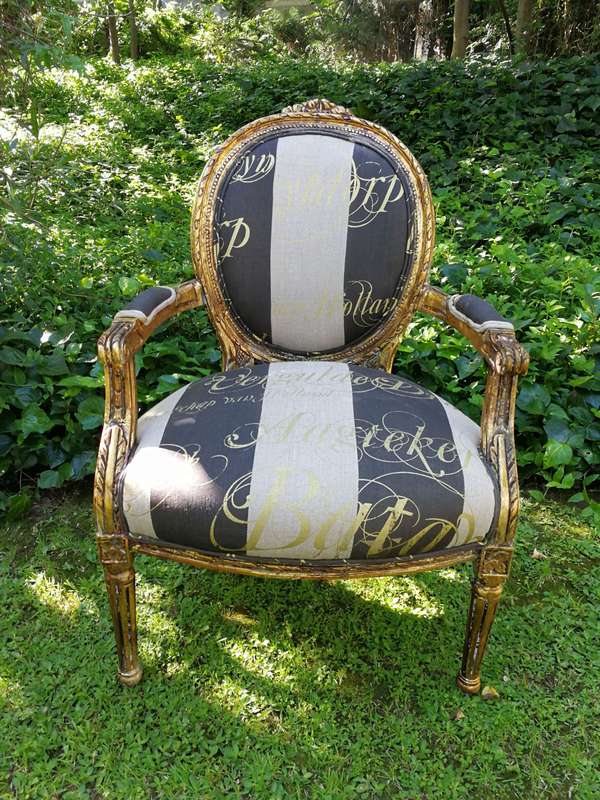 A Pair of French Style Arm Chairs Hand Gilded With Gold Leaf And Upholstered In an Imported Scrip...