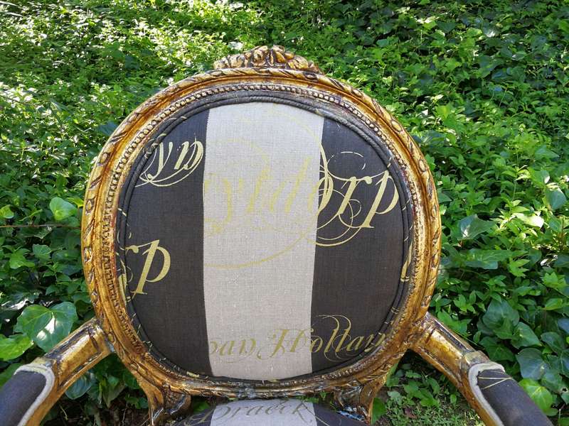 A Pair of French Style Arm Chairs Hand Gilded With Gold Leaf And Upholstered In an Imported Scrip...