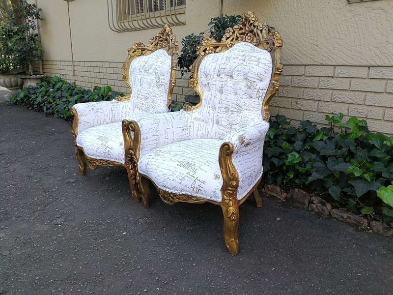 A Pair Of French Baroque Ornately Carved Gilded Arm Chairs Upholstered in an Exclusive and Custom...