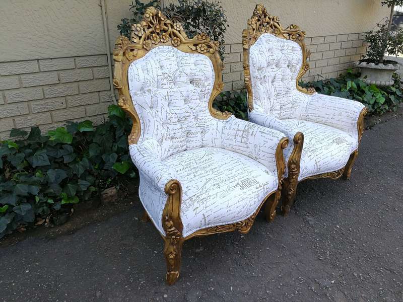 A Pair Of French Baroque Ornately Carved Gilded Arm Chairs Upholstered in an Exclusive and Custom...