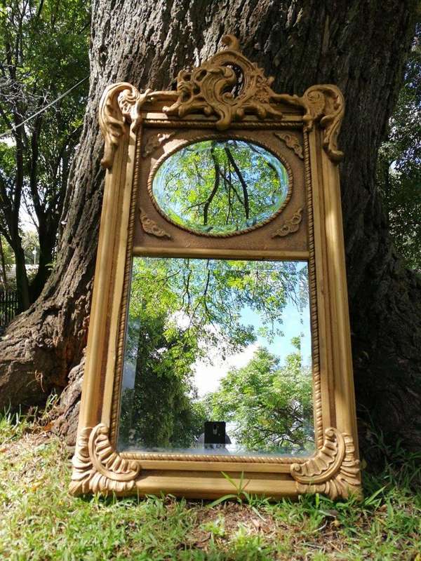 Ornately Carved Oval Gilded Mirror