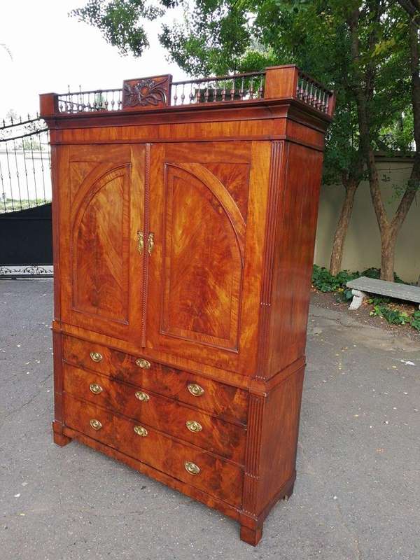 A Late Georgian Linen Press in Flame Mahogany with a Gallery Ornate Crown Circa 1780s