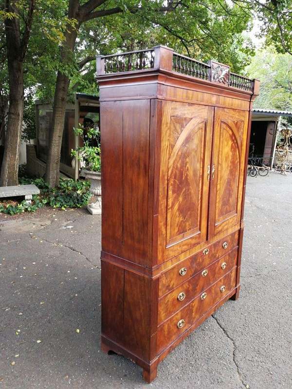A Late Georgian Linen Press in Flame Mahogany with a Gallery Ornate Crown Circa 1780s