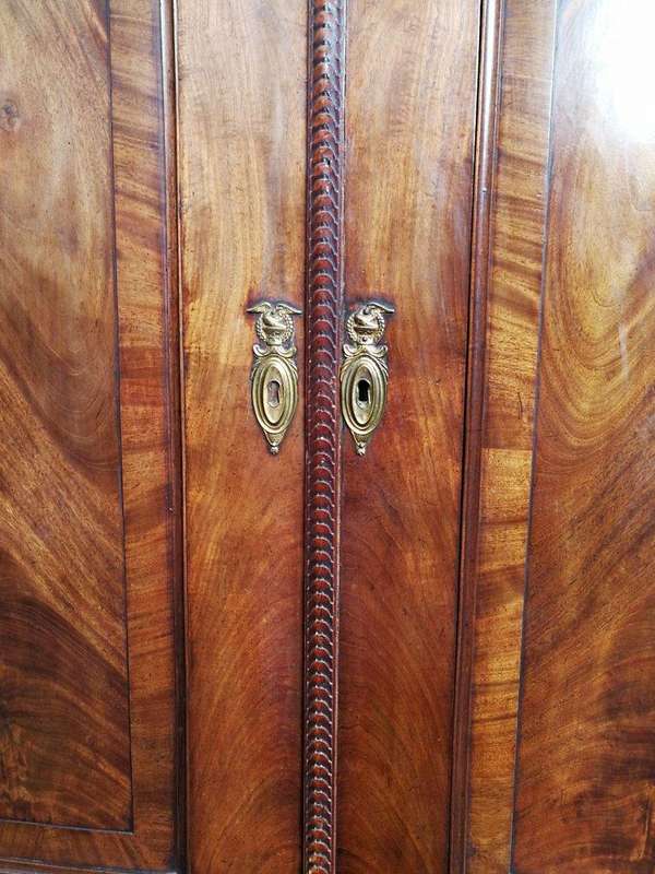 A Late Georgian Linen Press in Flame Mahogany with a Gallery Ornate Crown Circa 1780s