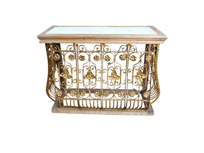 A wooden and marble-topped cast-iron console table