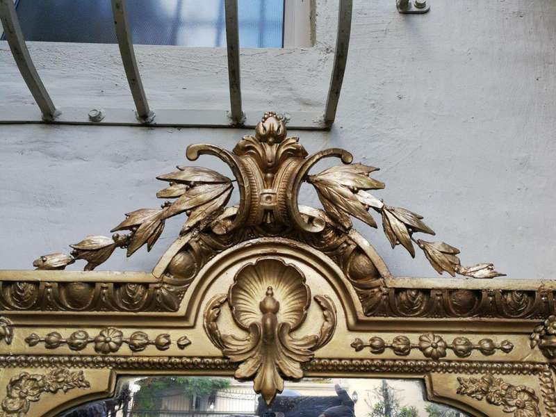 A gilded girandole mirror