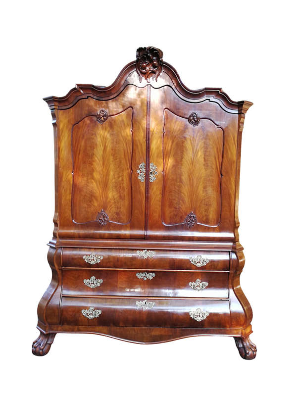 An 18th century (circa 1770) Dutch mahogany cabinet on bombe base/armoire with the original brass...
