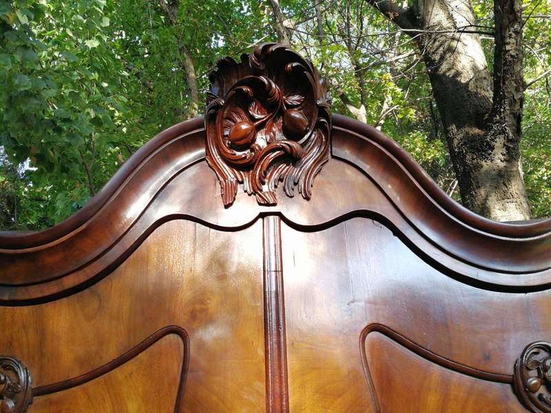 An 18th century (circa 1770) Dutch mahogany cabinet on bombe base/armoire with the original brass...