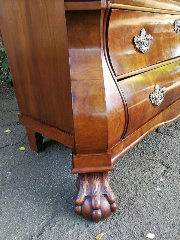 An 18th century (circa 1770) Dutch mahogany cabinet on bombe base/armoire with the original brass...