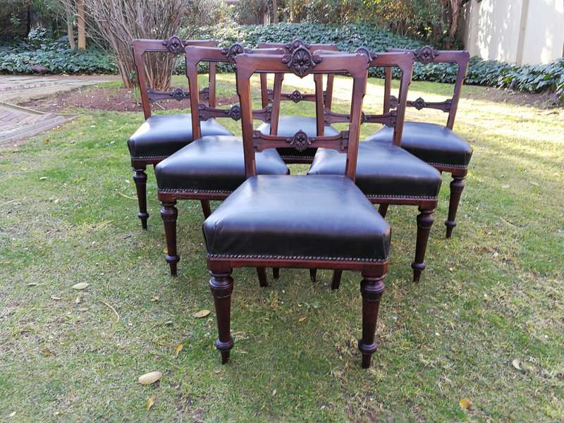 Set of six early Victorian chairs upholstered in black leather upholstered