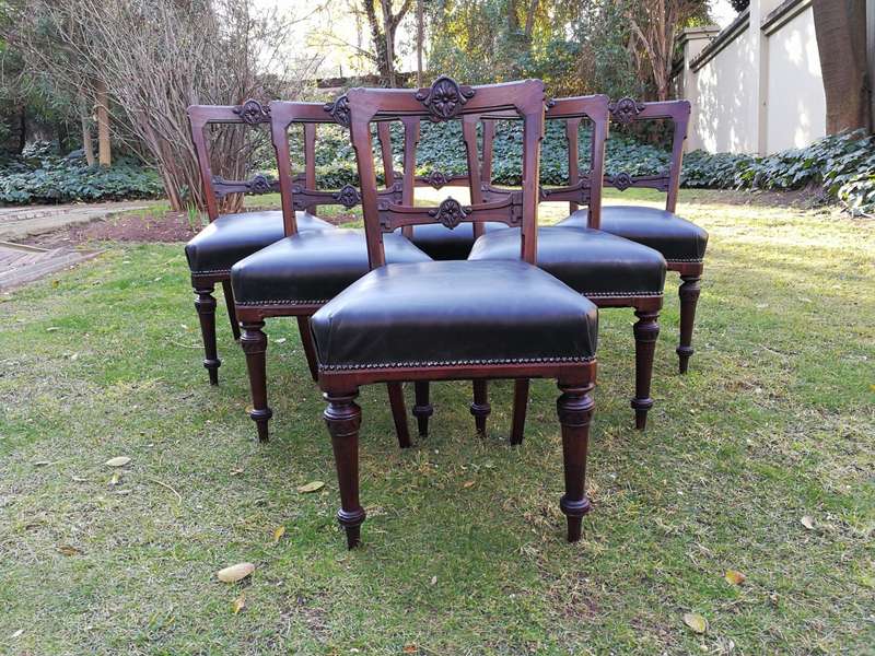 Set of six early Victorian chairs upholstered in black leather upholstered