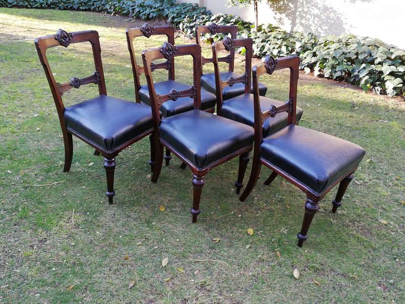 Set of six early Victorian chairs upholstered in black leather upholstered