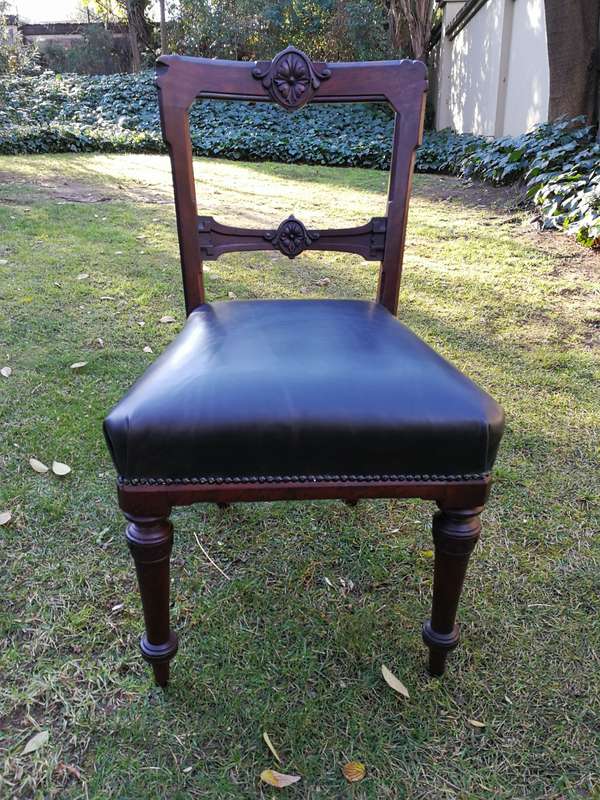 Set of six early Victorian chairs upholstered in black leather upholstered
