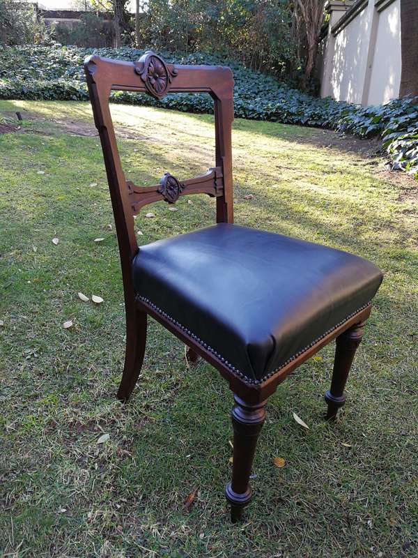 Set of six early Victorian chairs upholstered in black leather upholstered