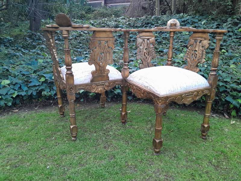 An Antique French-Style Carved Conversation Settee Hand-Gilded and Upholstered in a Custom-made S...