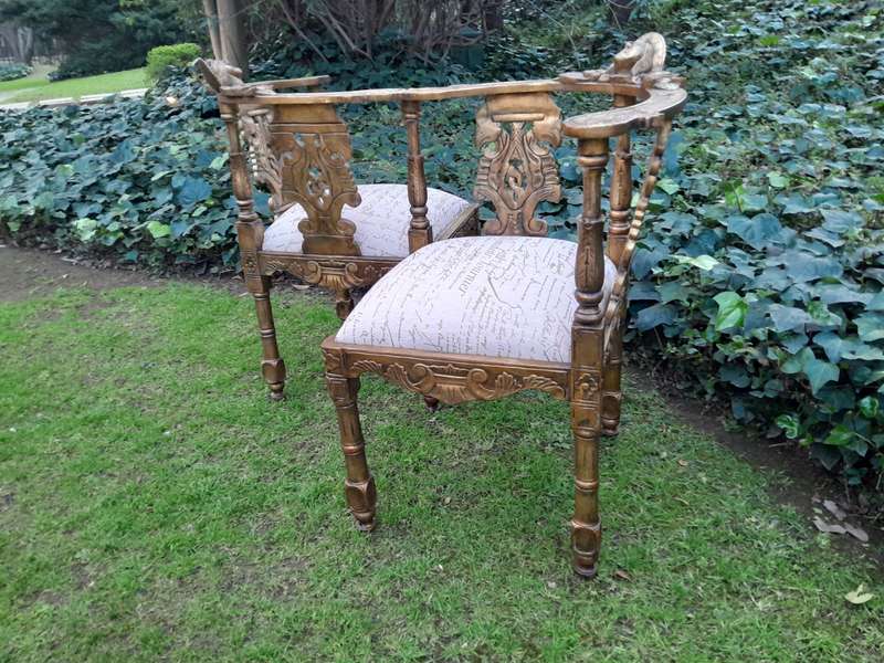 An Antique French-Style Carved Conversation Settee Hand-Gilded and Upholstered in a Custom-made S...