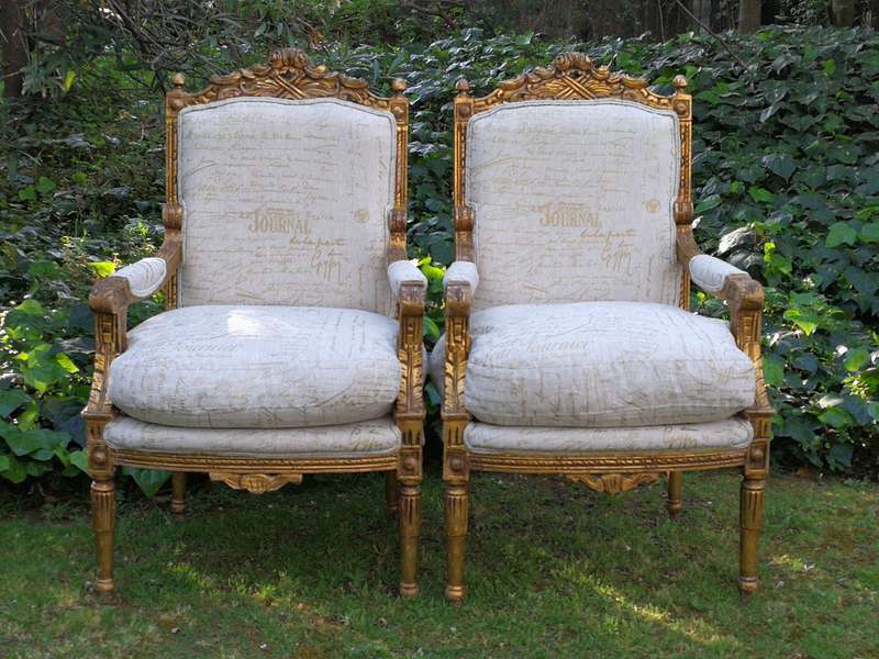 Pair of 19th Century style gilded and carved armchairs