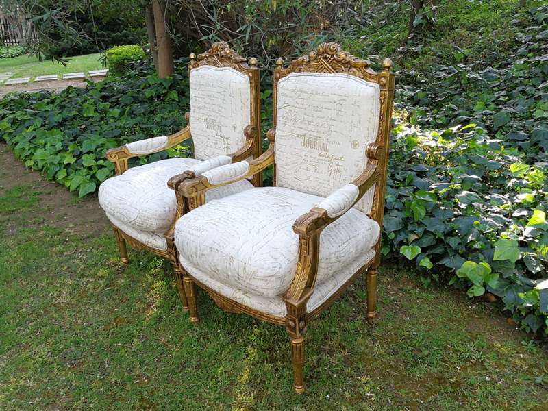 Pair of 19th Century style gilded and carved armchairs