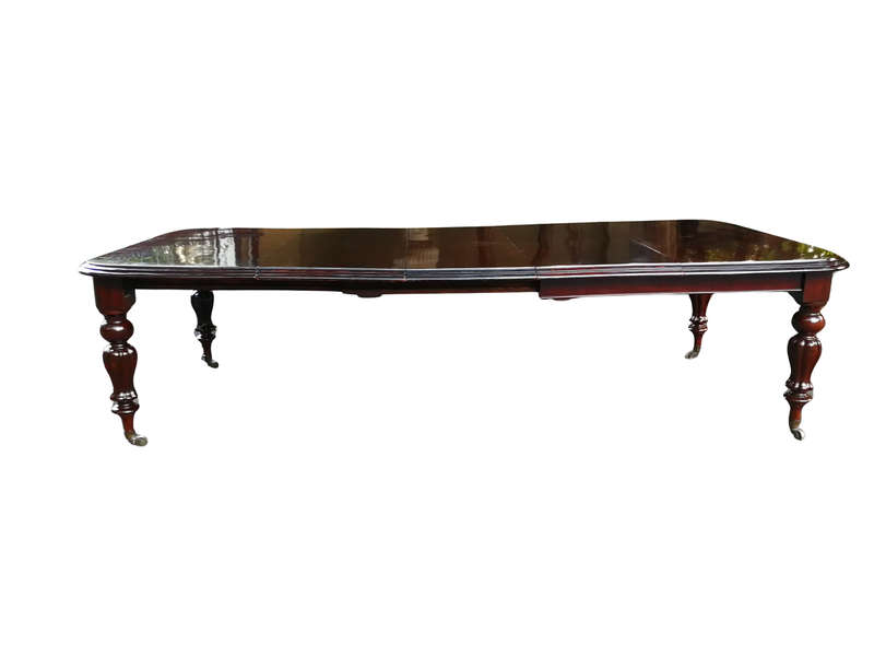 Victorian mahogany almost 3 meter twelve-seater extending dining table on castors